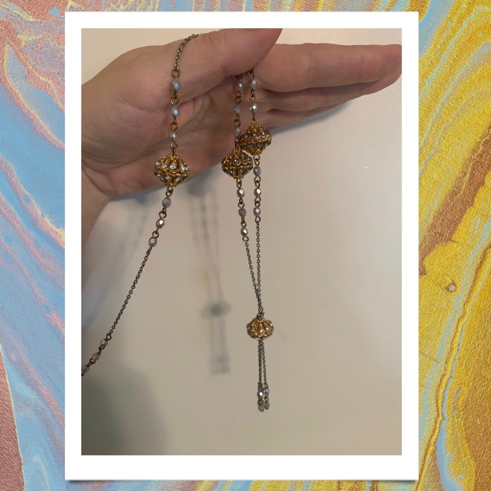 Long necklace with dangling pendant